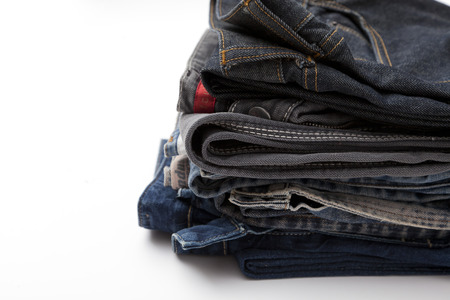 Stack of jeans isolated on whiteの写真素材