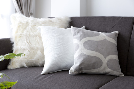 white soft cushion on sofaの写真素材