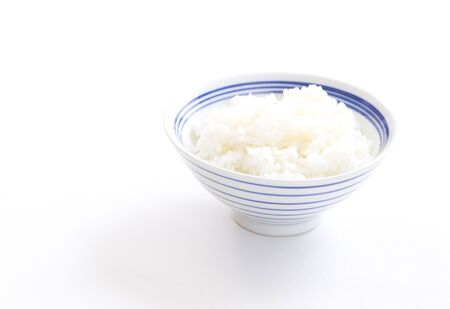 bowl full of rice on whiteの写真素材