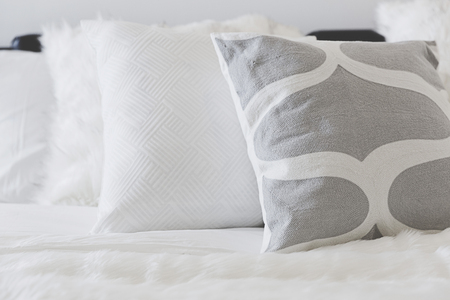 white soft cushion on sofaの写真素材