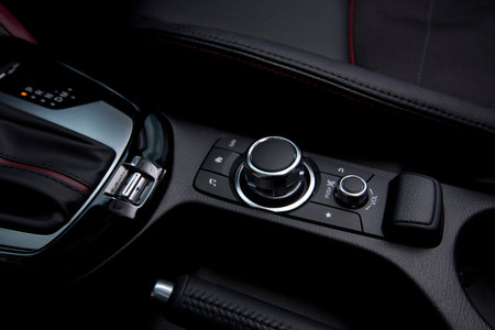 close up of modern car audio entertainment control button