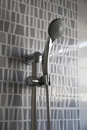 Silver shower head  in the bathroomの写真素材