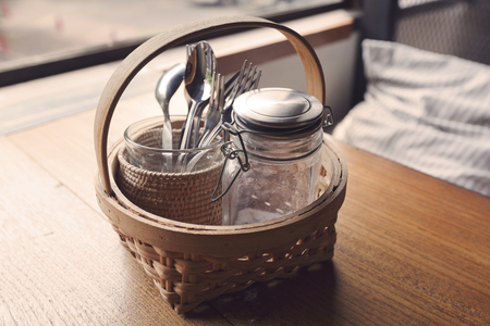 Wooden table with salt and pepper shakersの写真素材