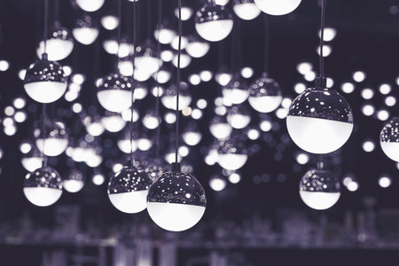 Abstract background of many hanging light bulbs