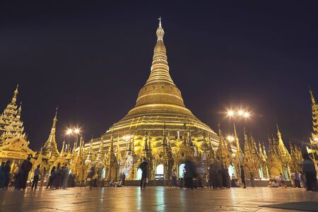 Shwedagon Pagoda at night in Yangon, Myanmar (Burma)の写真素材