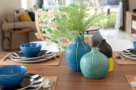 modern dinning room with wooden table and black chair at homeの写真素材