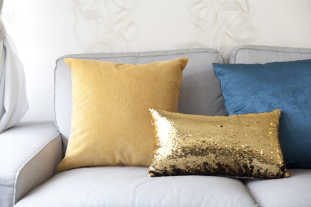comfortable sofa and colorful cushionの写真素材