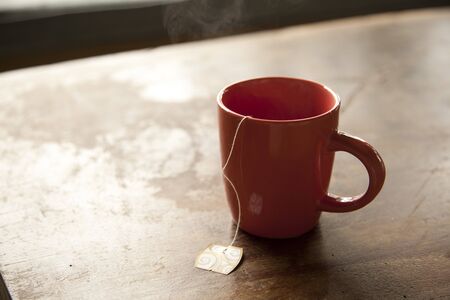 Cup of tea on wooden backgroundの写真素材