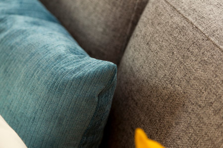 Sofa with colorful pillows in room