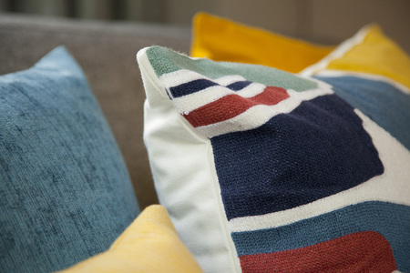 Sofa with colorful pillows in roomの写真素材