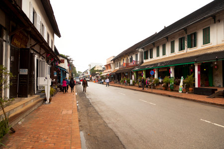 people walking on Sisavangvong Road, Luang Prabang, Laosのeditorial素材