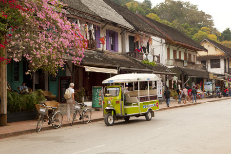 people walking on Sisavangvong Road, Luang Prabang, Laosのeditorial素材