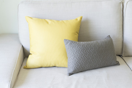 Colorful modern pillows on a sofaの写真素材