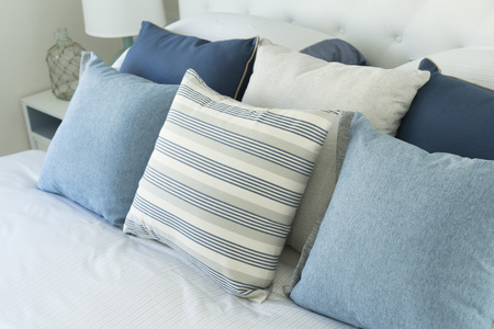 blue pillow on bedの写真素材