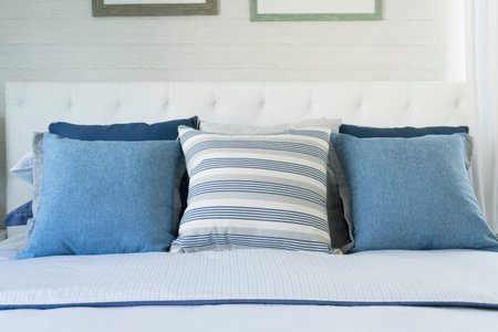 blue pillow on bed