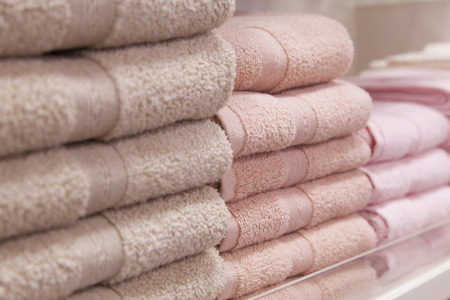 pile of towel on shelfの写真素材