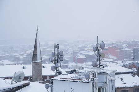 A winter view from the city of Istanbul with houses covered with white snowの写真素材
