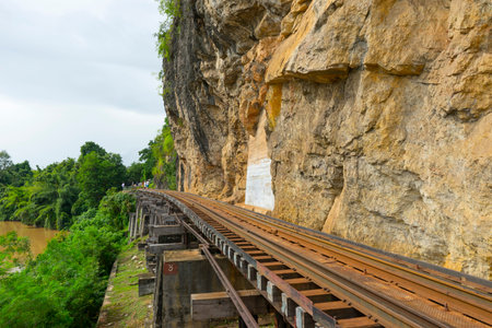 Death Railway train passing over the Tham Krasae Viaduct.の写真素材