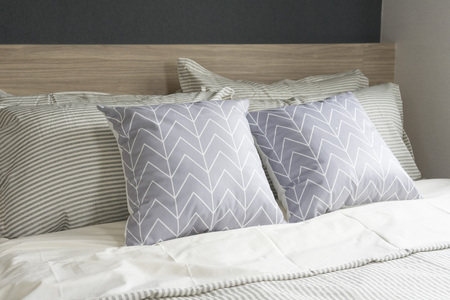 Modern bedroom interior with wooden bedの写真素材