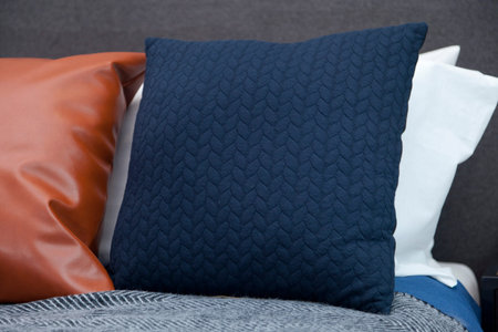 comfortable white and grey pillow on bed