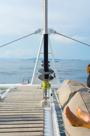 Fittings of a sailing yacht with ropes close-up. On the background of the ocean