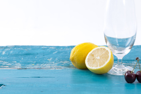 Fresh lemons slice on rustic wooden background.の写真素材