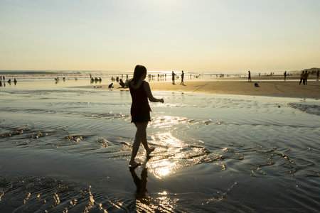 Crowd of people enjoy the sea breeze of Krambitan beach in Bali,Indonesia