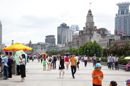 Group of Chinese enjoy weather at The Bund