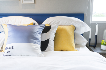 modern style blue and yellow pillow on bed in teenage bedroomのeditorial素材