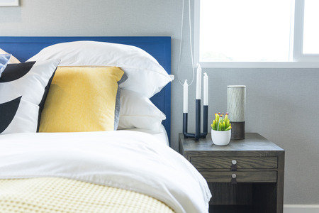 modern style blue and yellow pillow on bed in teenage bedroomの写真素材