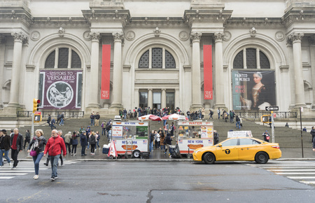 Crowded of tourist walking in front of The Metropolitan Museum on a Rainy Day in New York Cityのeditorial素材