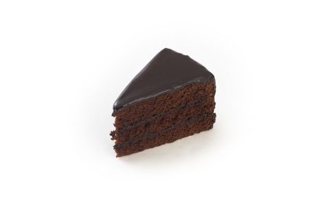 A slice of chocolate cake on a white backgroundの写真素材