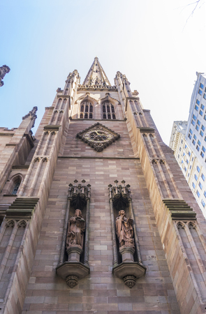 Trinity Church at the intersection of Wall Street and Broadway in Manhattan, New York, USAの写真素材