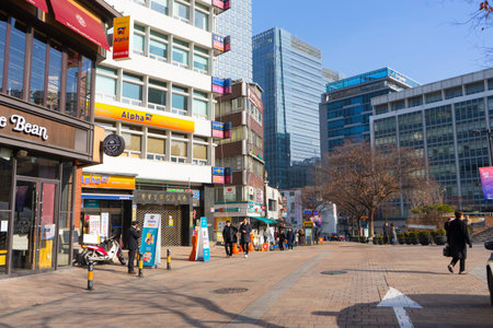 People shopping and walking in Myeongdong street market in Seoul, South Korea
