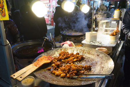 Traditional Korean Street Food at Night Market in Myeongdong shopping street in Seoul, South Koreaのeditorial素材