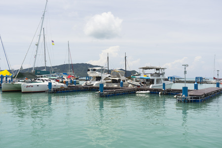 Many luxury yachts moored at Chalong Pier on sunny day in Phuket,Thailandのeditorial素材