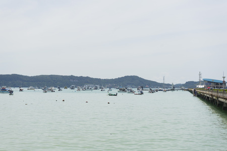 Many luxury yachts moored at Chalong Pier on sunny day in Phuket,Thailandの写真素材