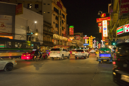 Street of Yaowarat at nighttime with many cars and tourists walking in Bangkok,Thailandのeditorial素材