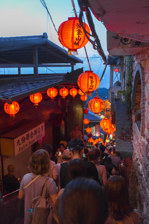 Beautiful red lantern of Old Town Jiufen with crowd of tourists sightseeing at nighttime in New Taipei City, Taiwanのeditorial素材