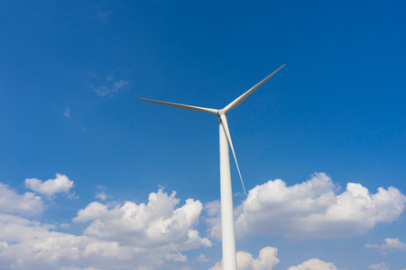 wind turbine against blue sky.