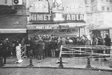 People walk on the Hamidiye Cd Street during the snowy weather in Istanbul, Turkey