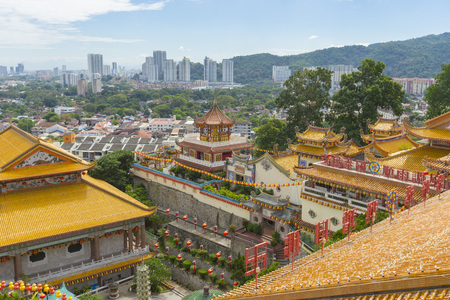 Yellow roof of Kek Lok Si Temple with Penang cityscape in Penang island, Malaysiaのeditorial素材