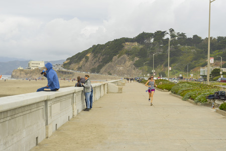 Unidentified people walking on the Ocean Beach Fire Pits in San Francisco, CAのeditorial素材