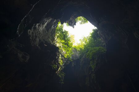 Amazing light shine through in Cave in Phetchaburi , Thailand.の写真素材