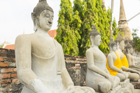 Row of Buddha statues in Wat Yai Chaimongkol in Ayutthaya ,Thailand.のeditorial素材