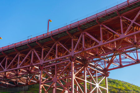close up of red beam structure of Golden Gate Bridge in San Francisco.
