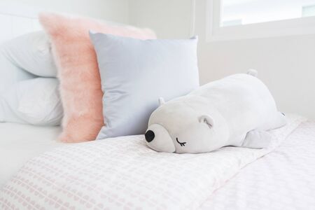 modern kid's bedroom and dolls on bed with wooden bed, interior decoration design conceptの写真素材