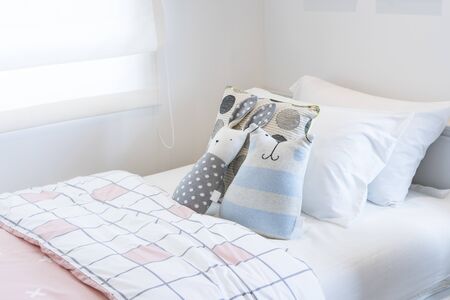 modern kid's bedroom and dolls on bed with wooden bed, interior decoration design conceptの写真素材