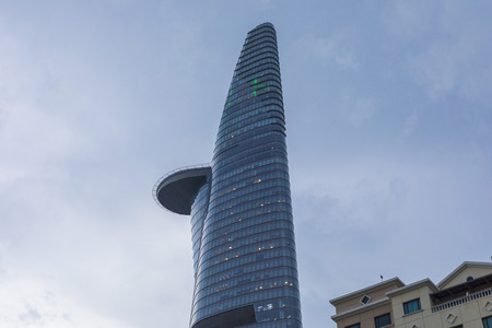 View of modern high-rise buildings Bitexco Financial Tower in evening light in Ho Chi Minh City, Vietnamのeditorial素材