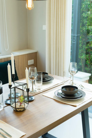 Modern dinning room interior with grey plate on wood table at home.